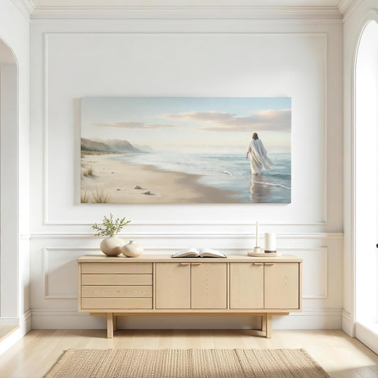 An entry room with a neutral-colored decor featuring a canvas of Jesus walking on a beach creating a tranquil, faith-inspired focal point above a light wood cabinet.