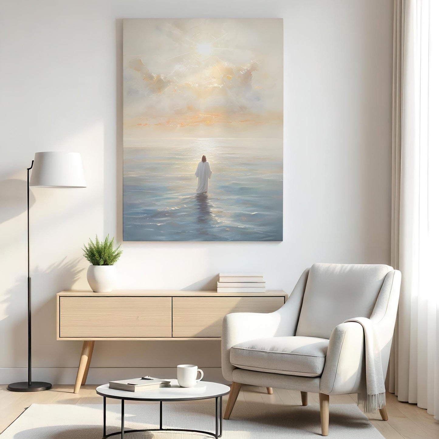 A serene living room with a large canvas of Jesus standing in calm ocean waters under a glowing sky. The space features a neutral armchair, wooden sideboard with books, a plant, a floor lamp, and a round coffee table, creating a peaceful atmosphere.