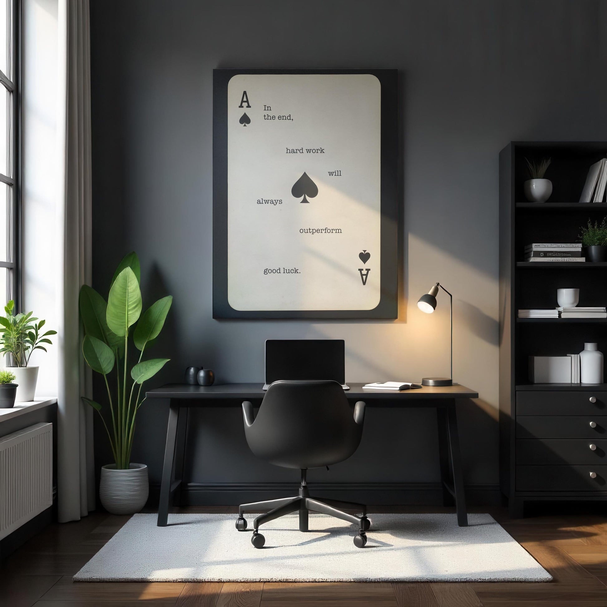 A sleek black home office with a minimalist Ace of Spades motivational canvas that reads, &quot;Hard work will always outperform luck.&quot; A black desk and chair, modern desk lamp, and green potted plant contrast against the dark walls. Soft natural light from a window adds warmth, enhancing the workspace’s focused and professional atmosphere.