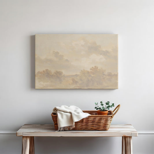 Neutral landscape canvas wall art above a rustic wooden console table. Styled with a woven basket, cozy throw blanket, and potted greenery for a warm, minimalist touch.