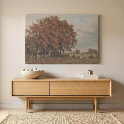 Autumn landscape canvas wall art displayed above a mid-century modern wooden sideboard. Styled with a ceramic bowl, gold-accented decor, and neutral elements for a warm, inviting space.