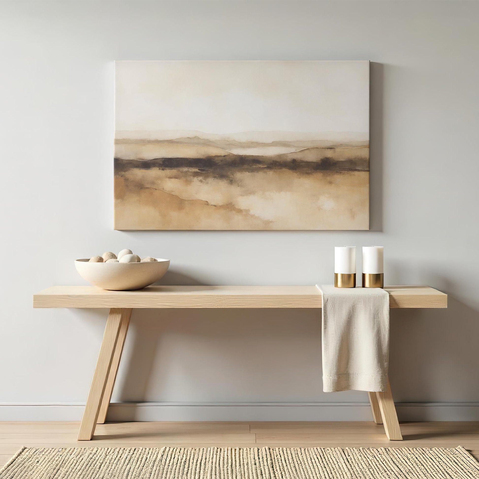 A neutral-toned abstract desert landscape canvas elegantly displayed above a modern wooden sideboard. Subtle decor elements, including gold-accented candles and a ceramic bowl, create a balanced, peaceful atmosphere.