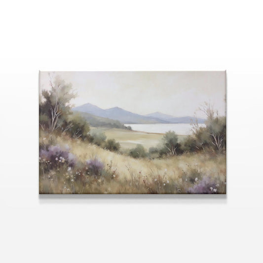 A nature-inspired canvas print featuring a tranquil meadow, wildflowers, a peaceful lake, and distant mountains. The soft, muted colors and serene scenery make it a perfect art piece for minimalist, rustic, or farmhouse decor.