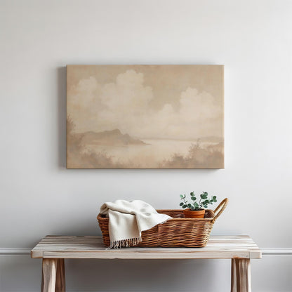 Soft, vintage-style lake landscape canvas print in warm earth tones. Displayed above a wooden bench with a woven basket and greenery, adding a cozy rustic charm to the space.