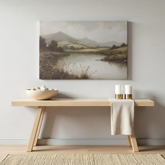 Large canvas wall art of a peaceful countryside river and rolling hills with a soft muted color palette. This rustic nature landscape print is perfect for farmhouse, cottagecore, and modern homes seeking calming wall decor with vintage charm.