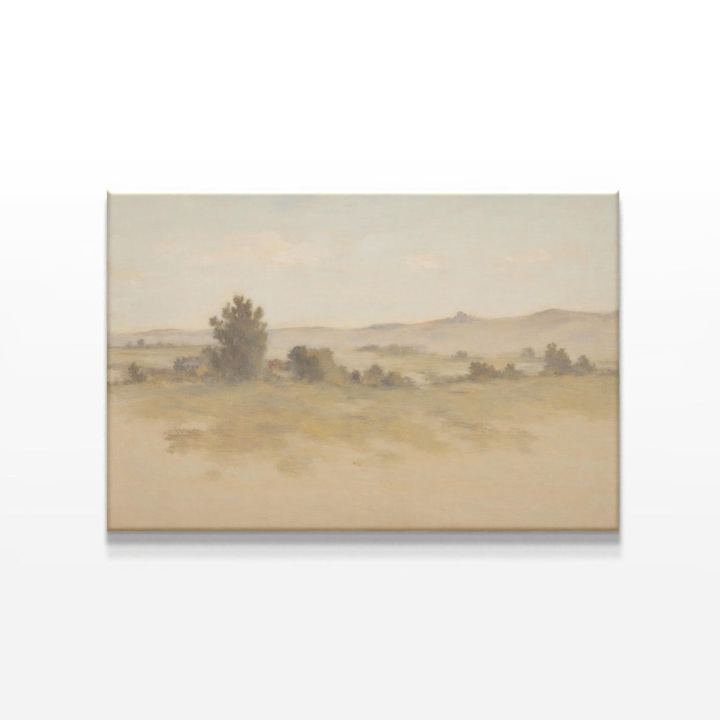 A soft, muted landscape canvas print displayed on a white wall. The artwork features rolling hills and a warm, earthy color palette, enhancing the organic aesthetic of a mid-century modern wooden sideboard below.