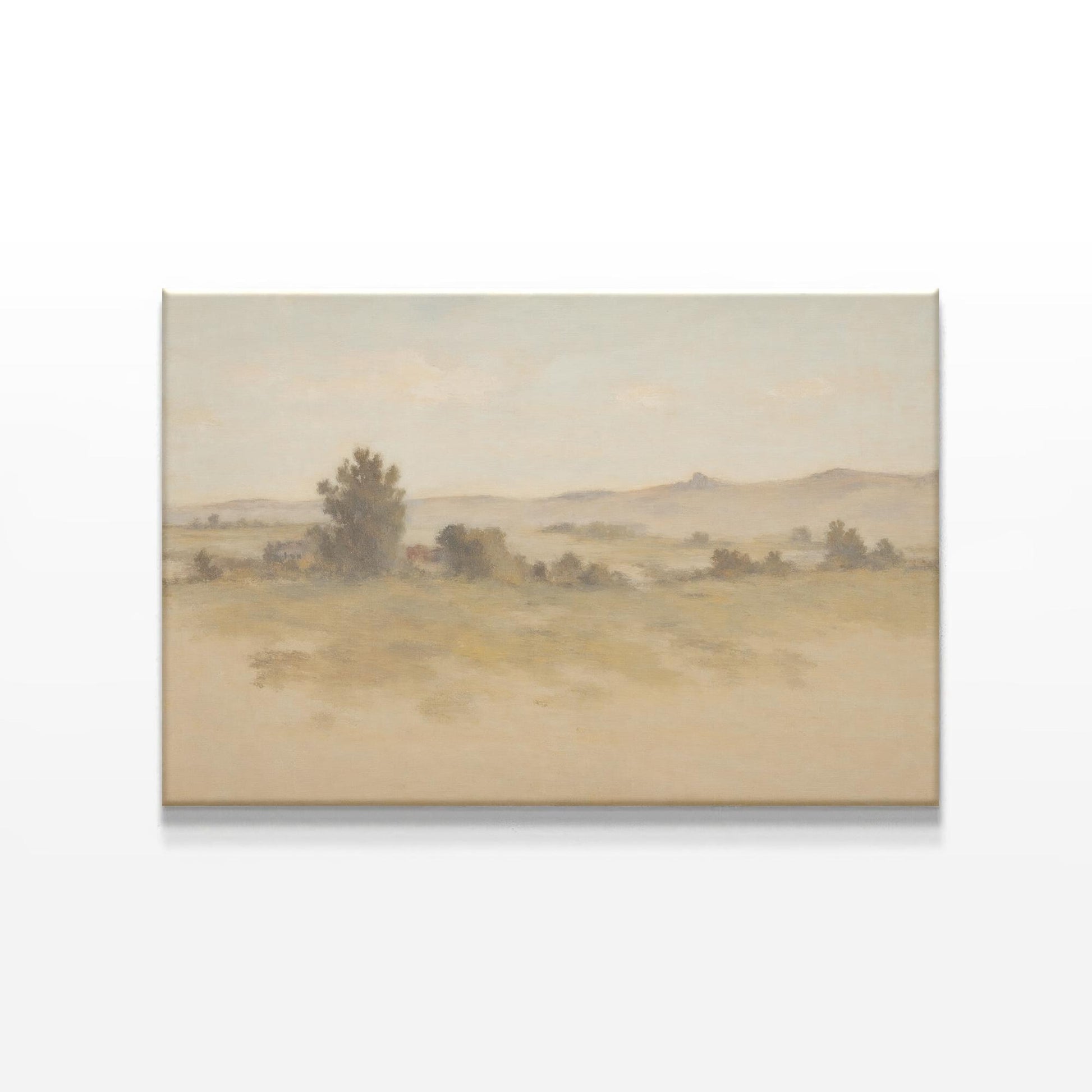 A soft, muted landscape canvas print displayed on a white wall. The artwork features rolling hills and a warm, earthy color palette, enhancing the organic aesthetic of a mid-century modern wooden sideboard below.