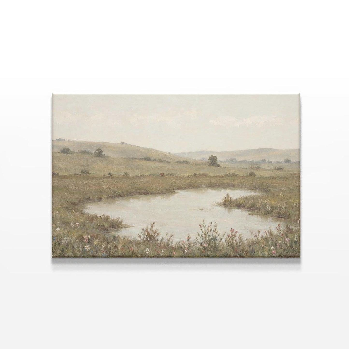 Serene landscape canvas art featuring a tranquil pond surrounded by rolling hills and wildflowers. A soft, neutral-toned painting perfect for nature-inspired wall decor in living rooms, bedrooms, or offices.