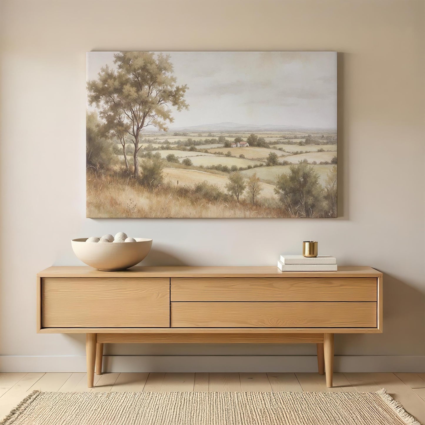 Farmhouse landscape canvas print featuring golden fields and distant hills, styled above a mid-century modern wooden sideboard. Neutral earth tones complement minimalist and classic home decor styles