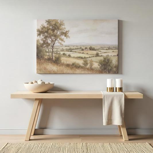 Rustic countryside canvas wall art above a modern wooden console table with neutral decor. Serene farmhouse-style wall decor for a living room, hallway, or entryway. Large wall art for home and office decor.