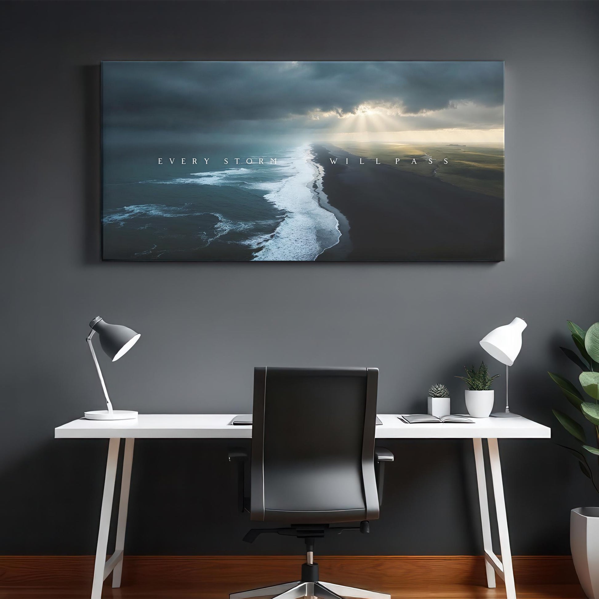 A sleek, modern workspace with a white desk, black chair, and stylish desk lamps. The &quot;Every Storm Will Pass&quot; canvas hangs above, adding an inspiring message to the minimalist and clean design of the room.