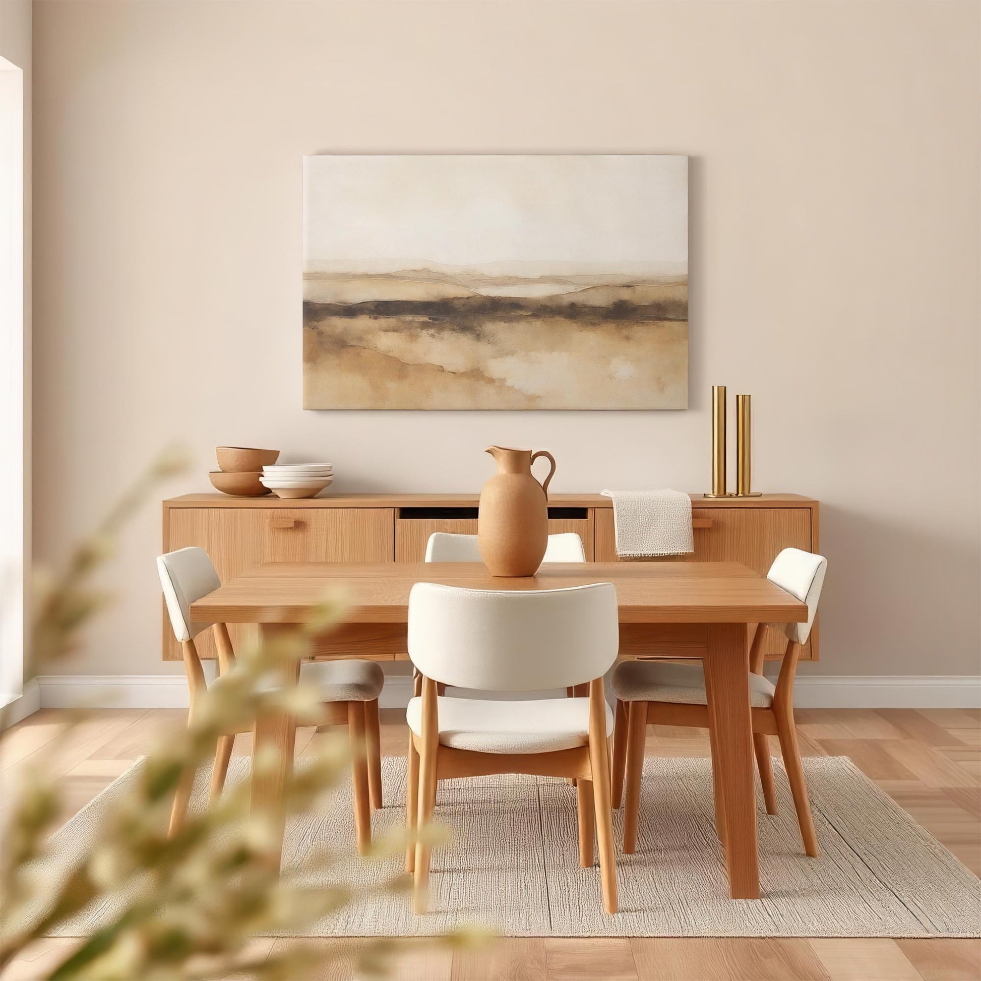 A contemporary dining room with a large neutral-toned abstract canvas art piece. The artwork&#39;s soft, earthy hues complement the natural wood furniture, warm lighting, and minimalist aesthetic for a tranquil setting.