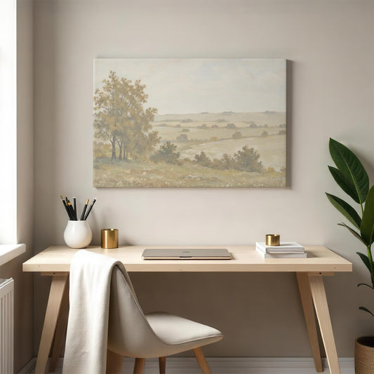 A pastoral landscape canvas displayed in a modern home office. The desk setup includes a sleek laptop, gold-accented decor, and a neutral palette that pairs seamlessly with the gentle tones of the artwork.