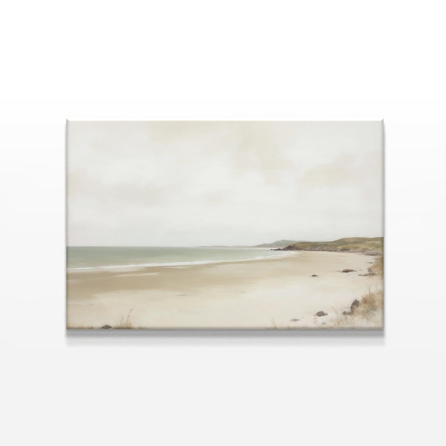 Large-scale beach landscape canvas print with soft beige sand and a tranquil shoreline. The framed artwork is displayed on a white wall, capturing a peaceful, coastal-inspired atmosphere for modern home decor.