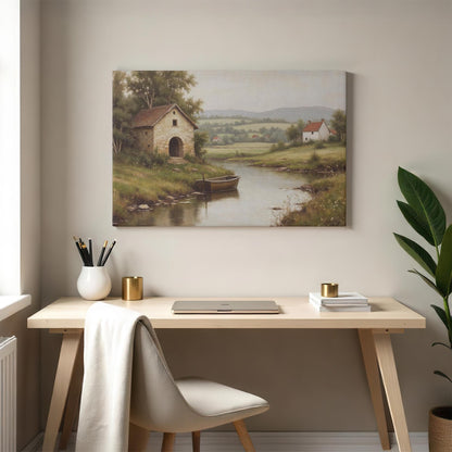 Countryside canvas wall art featuring a stone house, boat on a river, and rolling green hills, styled above a modern wooden desk with neutral decor and greenery. Ideal for office or home workspace aesthetics.