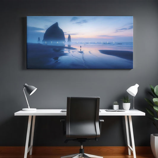 A modern office space with a minimalist desk and chair, featuring a large canvas art of a beach landscape with twilight colors, inspiring a focused, peaceful ambiance.
