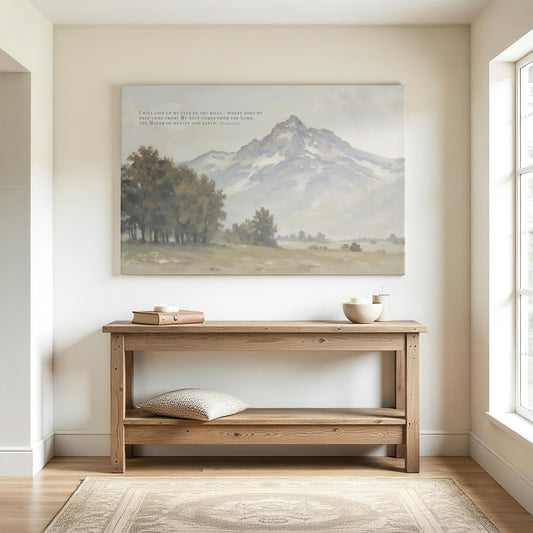 Bright hallway with a wooden console table and simple decor. A large canvas print of Psalm 121:1-2 with a soft mountain landscape is displayed above the table, bringing a calming and spiritual touch to the space.