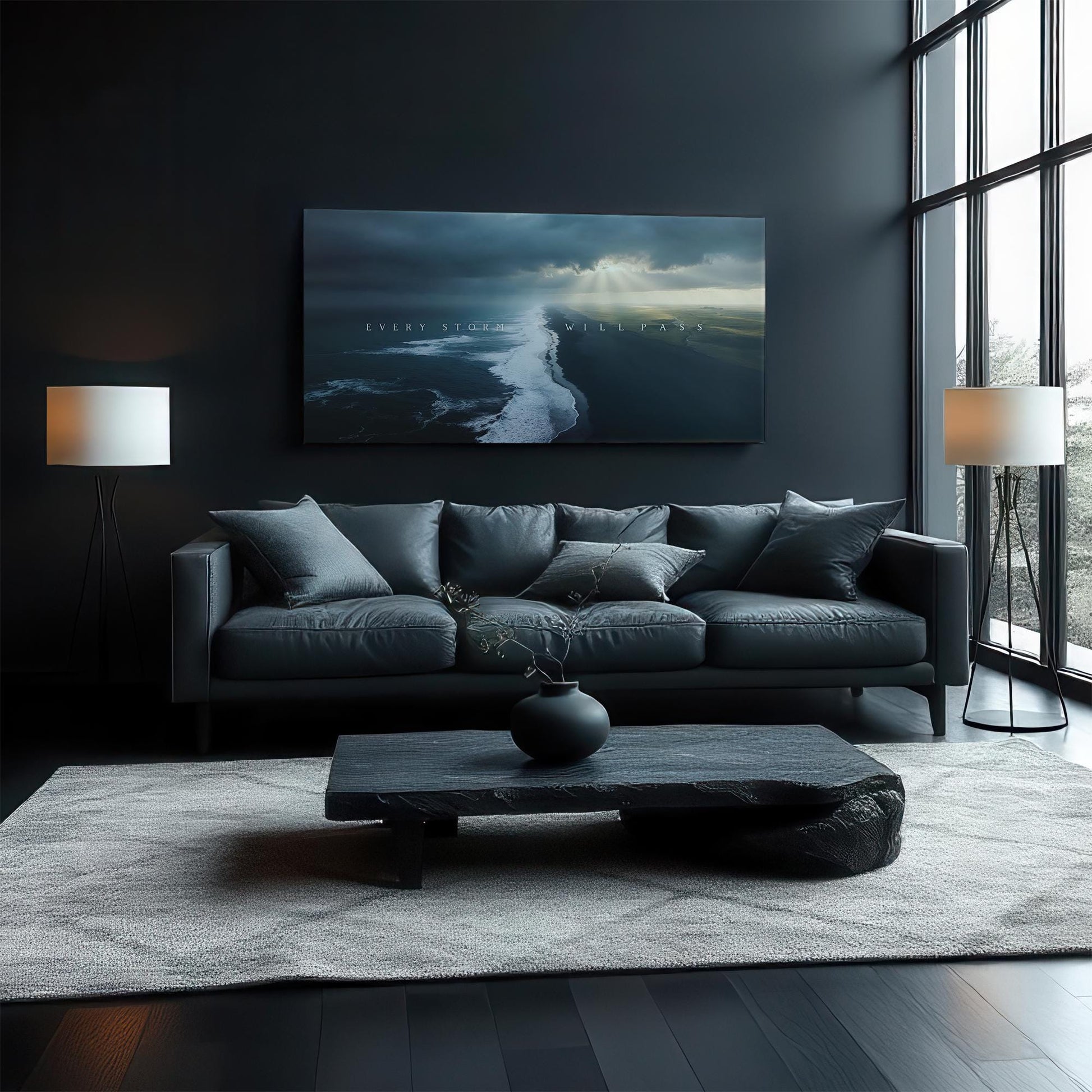 A chic, dark-toned living room with a comfortable gray sofa and minimalist décor. The &quot;Every Storm Will Pass&quot; artwork is prominently displayed above the sofa, complementing the room&#39;s serene yet contemporary vibe.