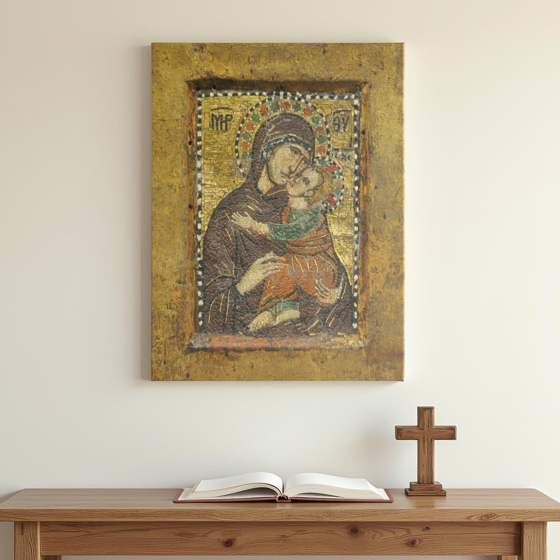 Canvas art featuring a Byzantine mosaic icon of Mary holding baby Jesus lovingly, mounted above a minimalist wooden table with an open Bible and wooden cross, creating a peaceful prayer space.