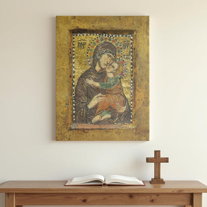 Canvas art featuring a Byzantine mosaic icon of Mary holding baby Jesus lovingly, mounted above a minimalist wooden table with an open Bible and wooden cross, creating a peaceful prayer space.