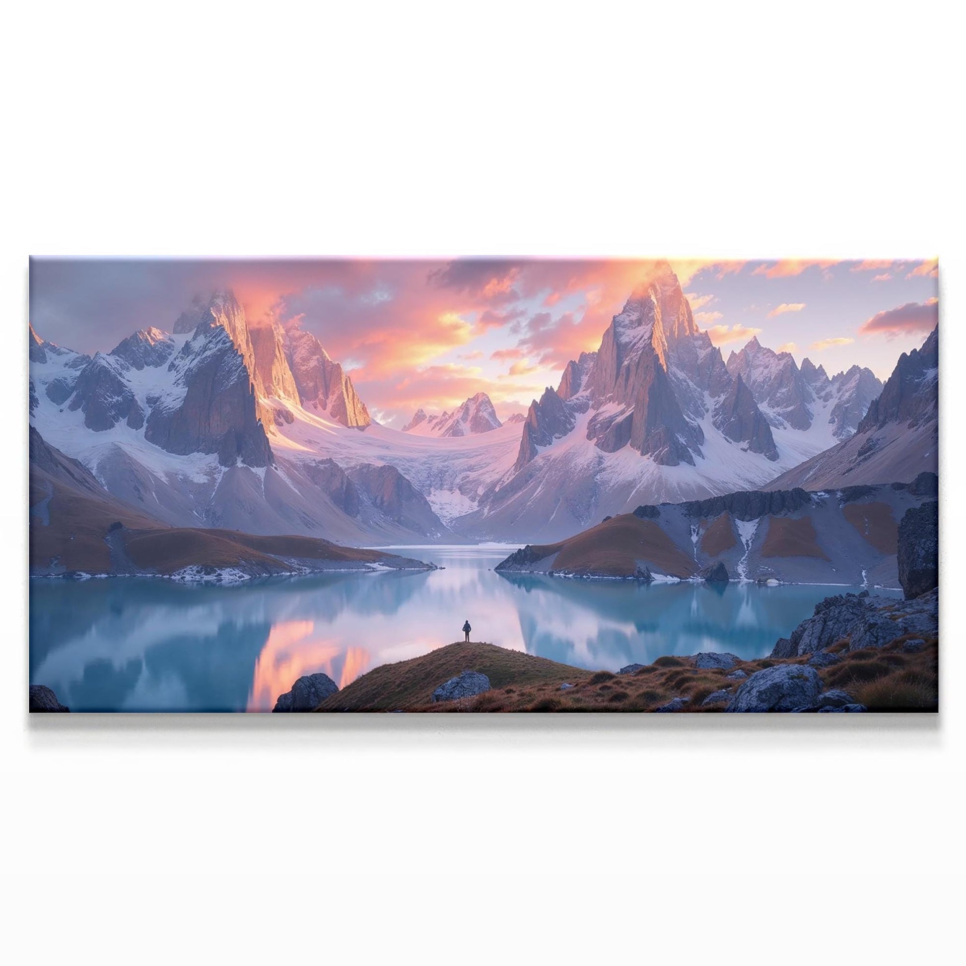 A breathtaking landscape of towering, snow-capped mountains bathed in the warm hues of a sunset, reflecting on a tranquil alpine lake. The sky glows with soft pinks and oranges, contrasting with the crisp blue tones of the peaks. A lone figure stands at the lake’s edge, adding depth and a sense of scale. This panoramic nature art print captures the majesty of the wilderness, ideal for modern or rustic decor.