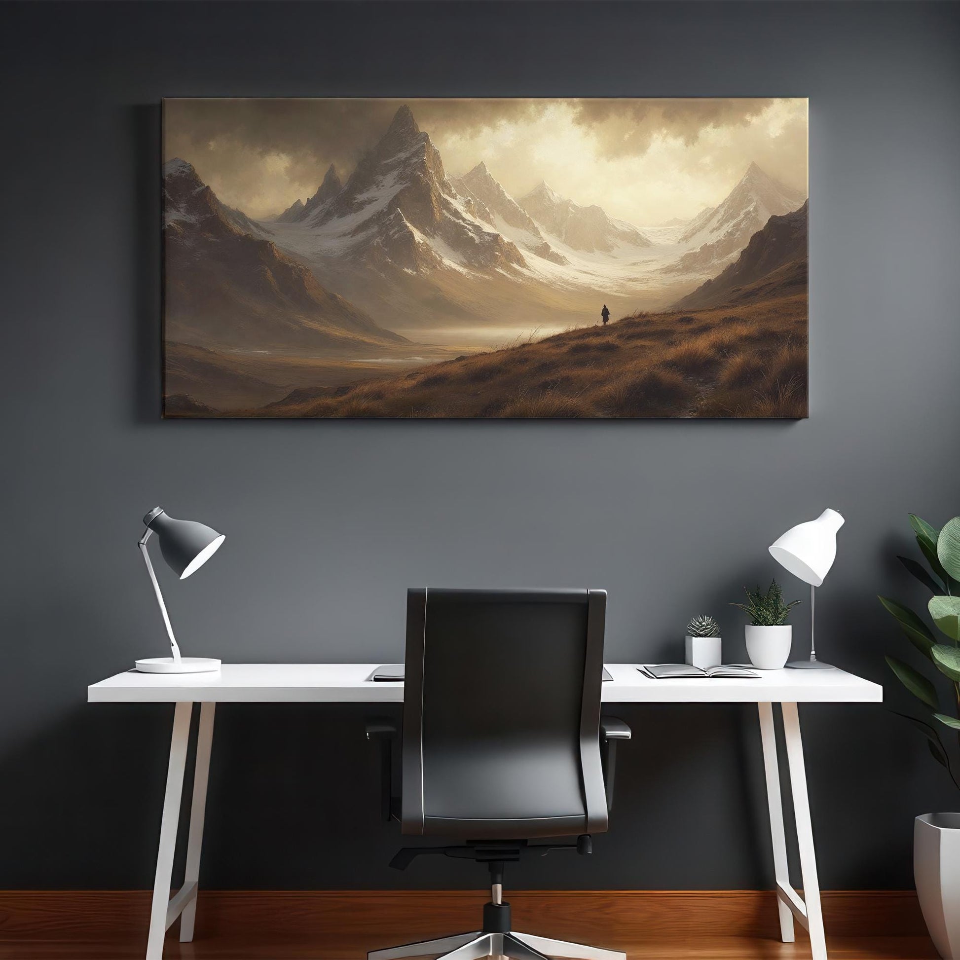 Modern office setting with dark walls featuring a striking landscape canvas of misty mountains and expansive valleys under cloudy skies, centered above a minimalist white desk, evoking calm and inspiration.