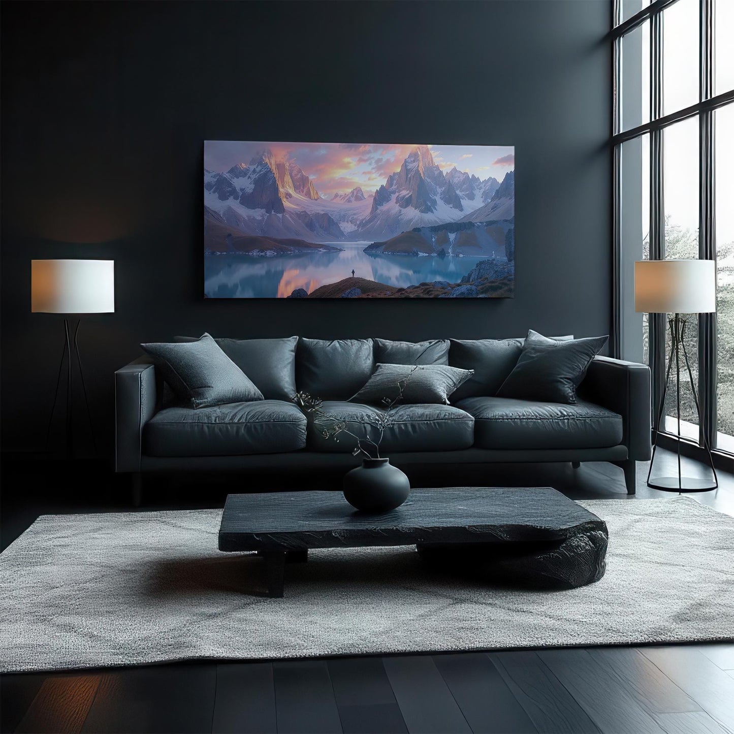 A stunning panoramic canvas print featuring majestic mountains and a glowing sunset reflection over a serene alpine lake. The warm golden tones contrast beautifully with the soft whites and cool blues of the peaks. Displayed in a bright, modern living room, this landscape art enhances the aesthetic with its tranquil yet powerful presence, making it a perfect centerpiece for nature lovers and adventure seekers.