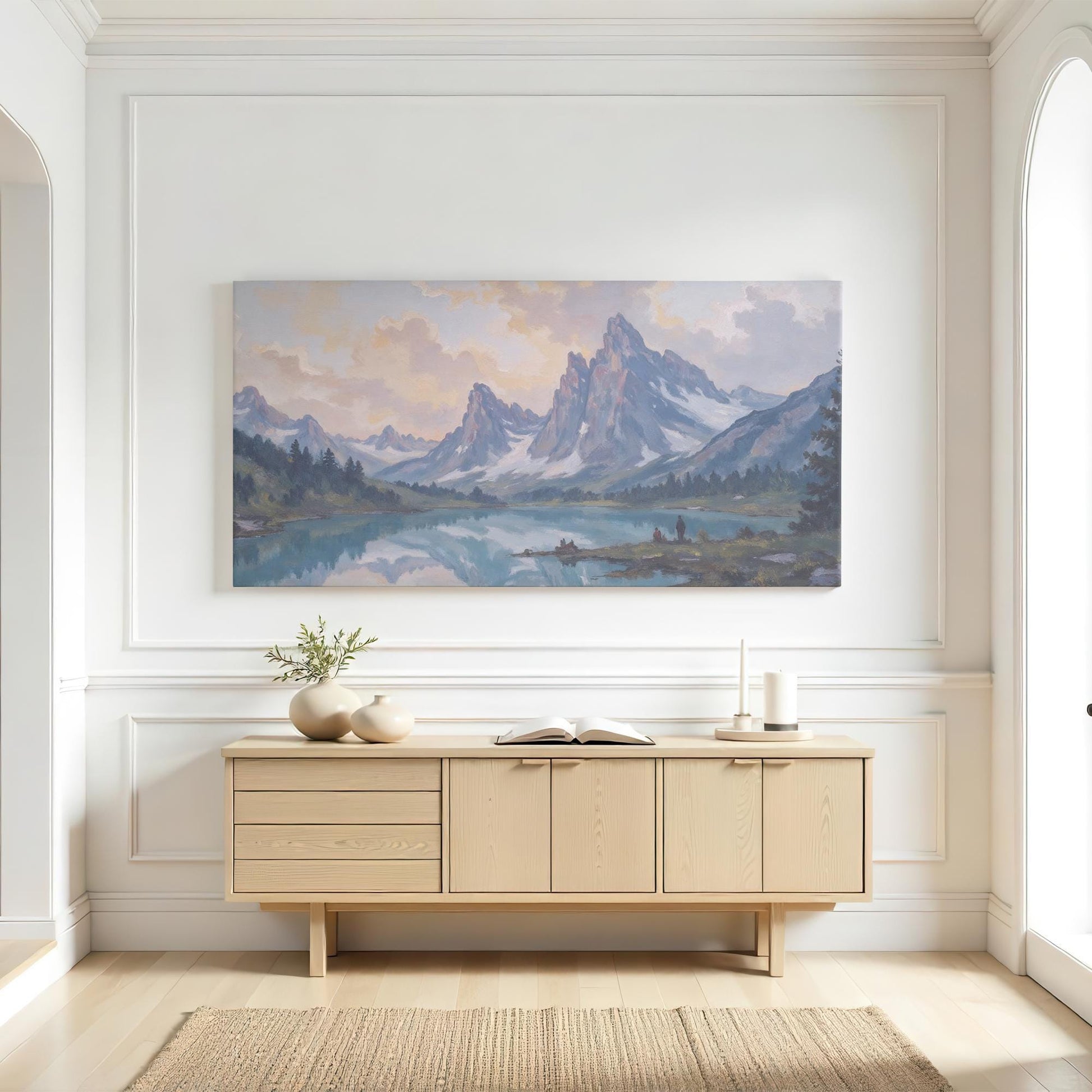 A serene mountain painting featuring towering peaks, soft golden light, and a tranquil lake reflecting the beauty of nature. The subtle blue-gray hues complement a clean, modern aesthetic, making it an ideal addition to minimalist home decor. A perfect choice for those who love nature-inspired artwork, cabin decor, or calming landscape prints.