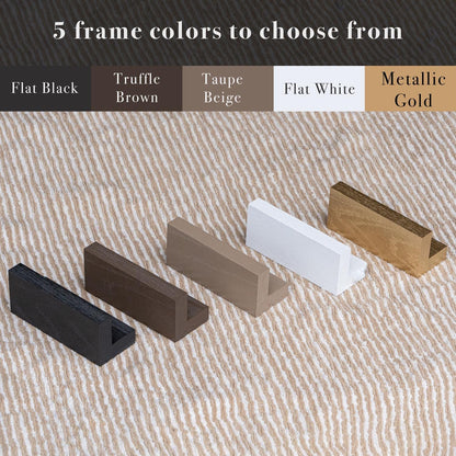 Five handcrafted floater frame options—Flat Black, Truffle Brown, Taupe Beige, Flat White, and Metallic Gold—shown over a natural woven background. These customizable frame colors offer buyers flexibility to match their Christian decor or spiritual gift preferences.