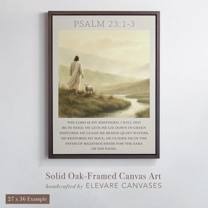 Framed Psalm 23 wall art featuring Jesus and a lamb walking by a peaceful stream with soft mountains in the background. Printed on fine canvas and set in a solid oak floater frame, this Christian home decor piece includes Psalm 23:1-3 in elegant serif text. A perfect Good Shepherd gift, scripture wall art, or faith-based decor for Christian households seeking inspiration and beauty.