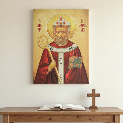 Orthodox icon of Saint Nicholas displayed on a minimalist white wall above a wooden prayer table with an open book and a small wooden cross. Soft lighting creates a peaceful, contemplative atmosphere.