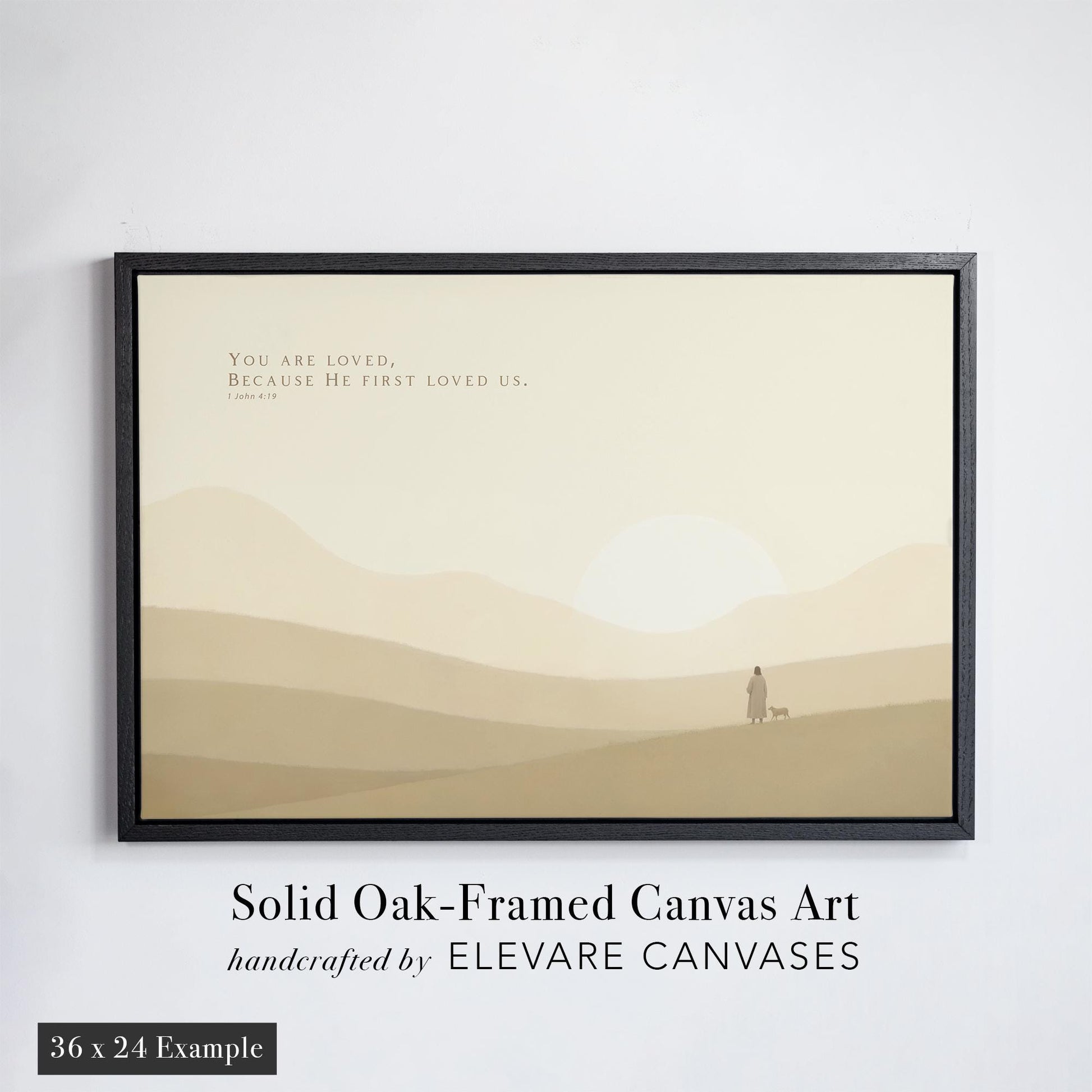 Minimalist Christian nursery art featuring the Bible verse &#39;You are loved, because He first loved us&#39; from 1 John 4:19. Set against soft beige rolling hills and a glowing sun, the solid oak black floater frame enhances the peaceful tone. A perfect piece of scripture wall art for nurseries, baby rooms, or spiritual home decor.