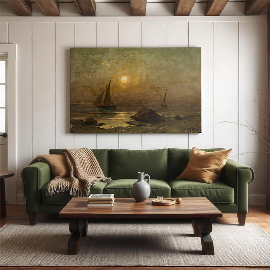 Displayed above a deep green couch in a cozy living room, this large unframed canvas print of Meremotiiv by Julius Sergius von Klever brings old-world coastal charm into a modern home. The soft glimmer of moonlight across the sea, paired with solitary sailboats and shoreline rocks, creates a peaceful and timeless atmosphere. Perfect for coastal cabins, lake houses, or rustic interiors seeking soulful serenity.