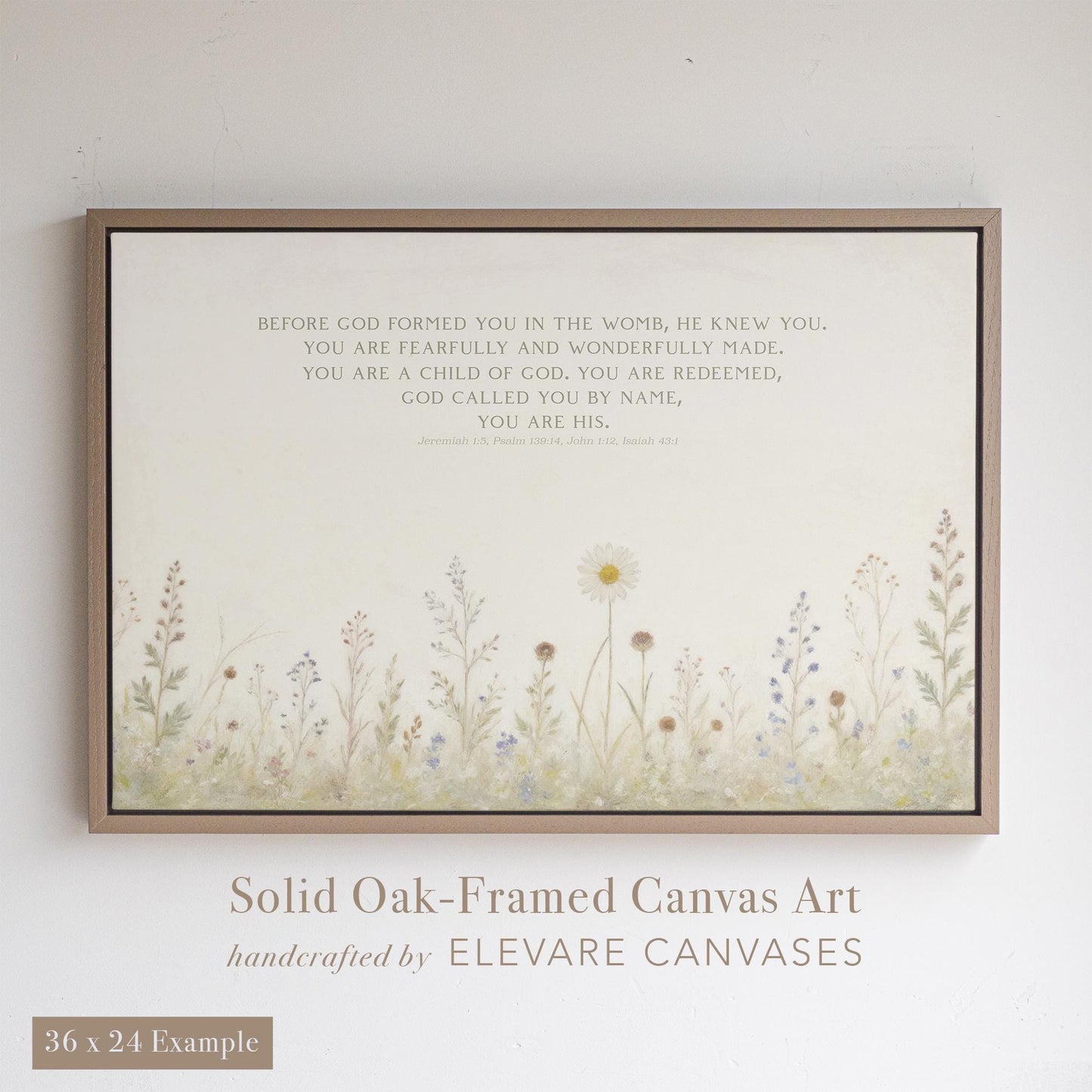 Christian wall art featuring Bible verses from Jeremiah 1:5, Psalm 139:14, John 1:12, and Isaiah 43:1 printed above hand-painted wildflowers. Displayed in a solid oak floater frame, this 36x24 canvas art from Elevare Canvases offers faith-based encouragement and elegant Christian home decor for nurseries, bedrooms, or entryways.